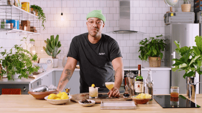 Bartender Rico demonstrating how to use aquafaba to make a Whiskey Sour