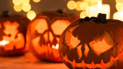 Three jack-o'-lantern Halloween lanterns