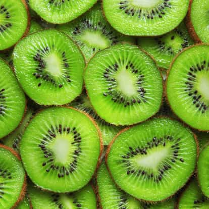 Kiwi sliced into rounds filling the frame