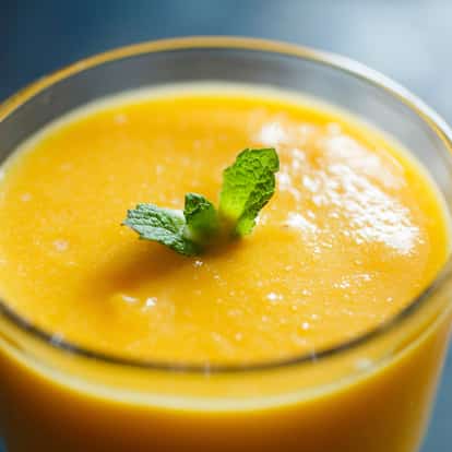 Mango Puree in a short glass with a mint sprig