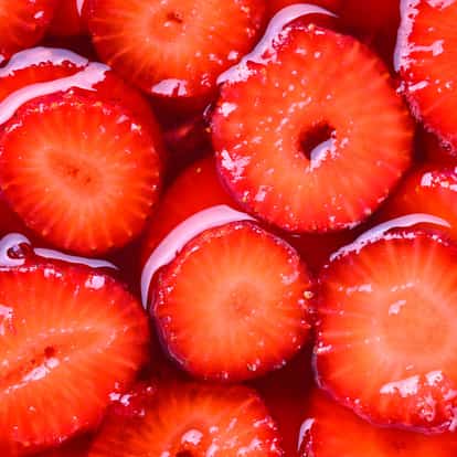 Strawberry Syrup with sliced strawberries in syrup