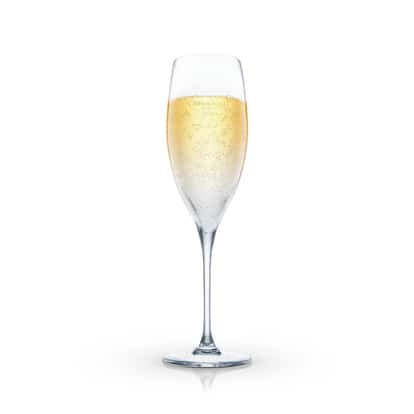 A single sparkling drink in a champagne flute on white background.