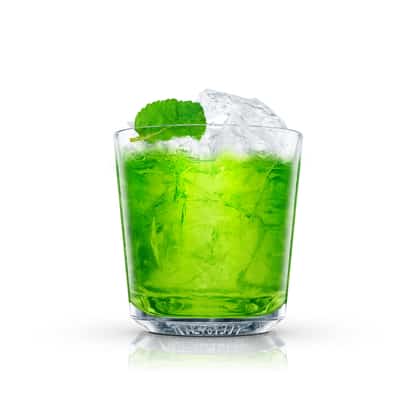 Absolut Berlin Sour in a rocks glass with crushed ice and a mint leaf on white background.