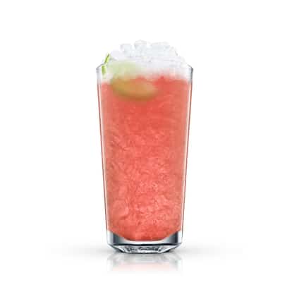Absolut Dolce in a highball glass with crushed ice and a lime wedge on white background
