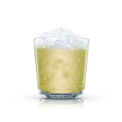 Absolut Green Apple served in a rocks glass with crushed ice on white background
