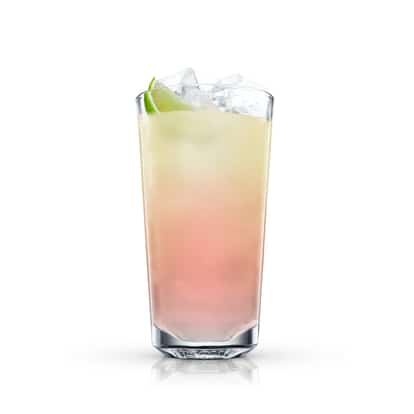 Absolut Mandrin Breeze in a highball glass with ice and a lime wedge on white background