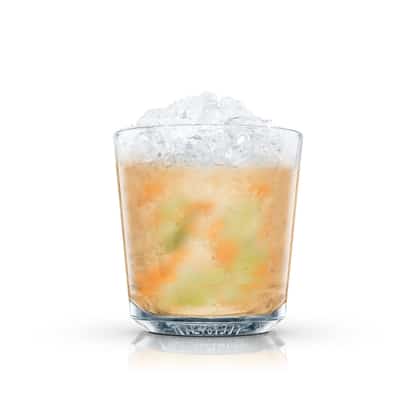 Cocktail with crushed ice and fruit pieces in an Absolut rocks glass on white background.