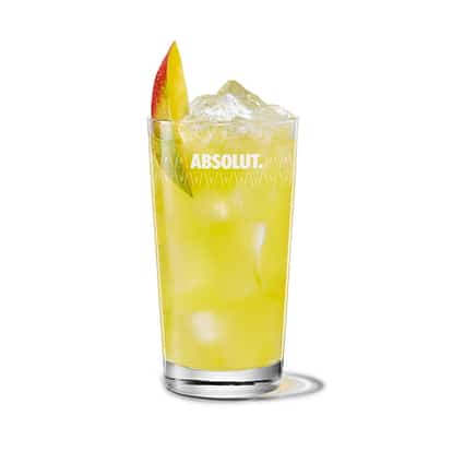 Absolut Mango with Orange Juice in a highball glass with ice and a mango wedge on white background