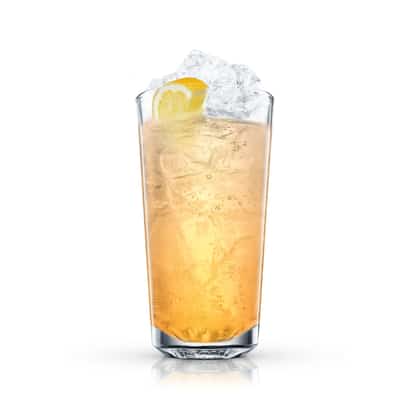 Absolut Pears And Mango Collins in a Collins glass with ice and a lemon wedge on white background