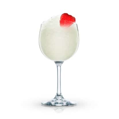 Absolut Peppar Daiquiri in a wine glass with crushed ice and strawberry on white background