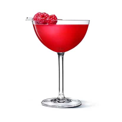 Absolut Raspberri Chocolate Martini in a coupe glass with raspberries on white background