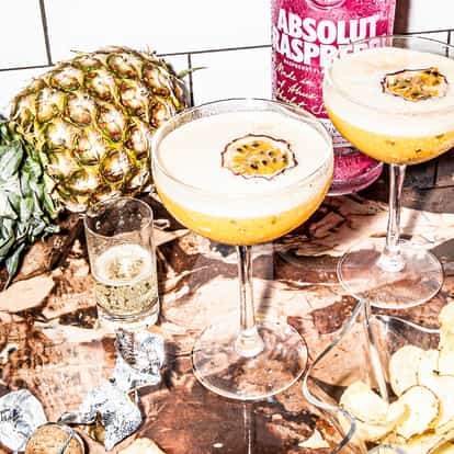PornstarMartini variation, the Absolut Raspberri Passion Star Martini next to a bottle of Absolut Raspberri.