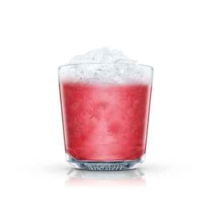 Pink cocktail with crushed ice in an Absolut rocks glass on white background.