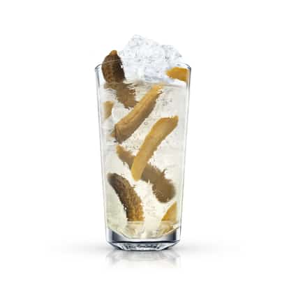 Clear cocktail with ice and pickle spears in a tall highball glass on white background.
