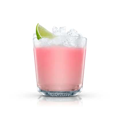 Absolut Vanilia Fruit Punch in a rocks glass topped with crushed ice and a lime wedge on white background