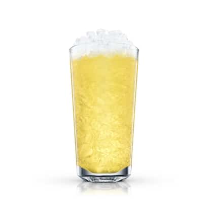 Yellow Fever served in a tall highball glass filled with crushed ice on white background.