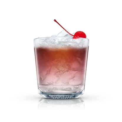 Ac served in an Absolut rocks glass with crushed ice and a maraschino cherry