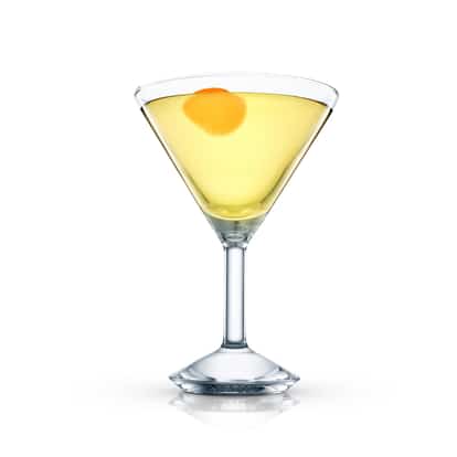 Alaska Martini in a martini glass with orange peel on white background