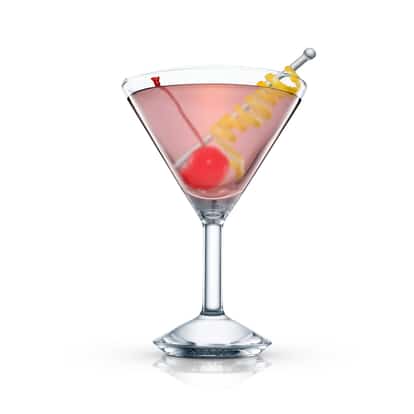 Angelica served in a martini glass with a maraschino cherry and lemon twist on a pick on white background