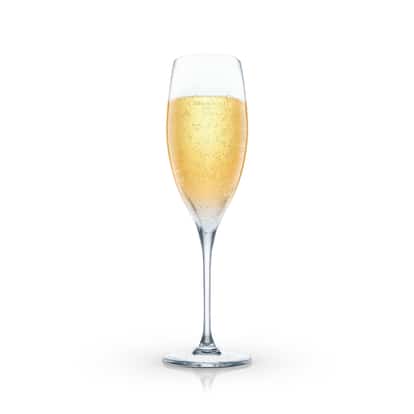 Apeach Bellini served in a champagne flute on white background.