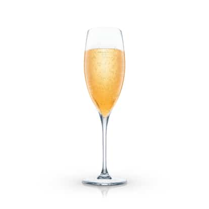 Baby Bellini in a champagne flute on white background