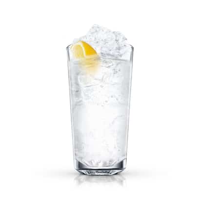 Bahamas Highball in a highball glass with ice and a lemon wedge on white background