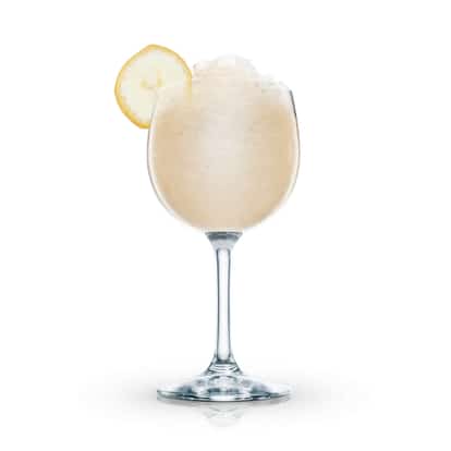 Banana Boat in a stemmed wine glass with crushed ice and a banana slice on white background