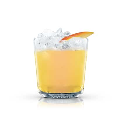Banana Mango served in an Absolut rocks glass with crushed ice and a mango slice on white background.