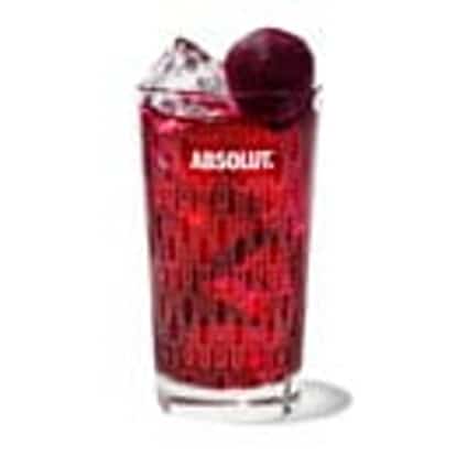 Beet & Breeze in an Absolut highball glass with crushed ice and a beet sphere garnish on white background