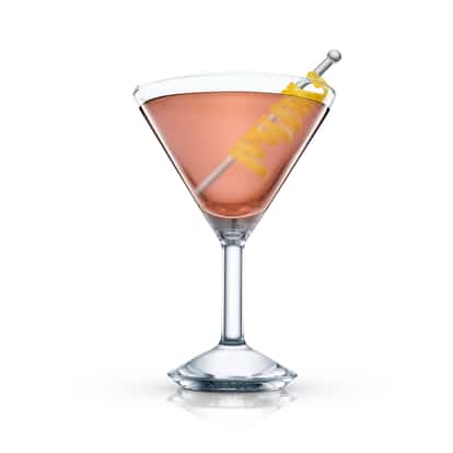 Believe It Or Not served in a martini glass garnished with a lemon twist on a metal pick on white background