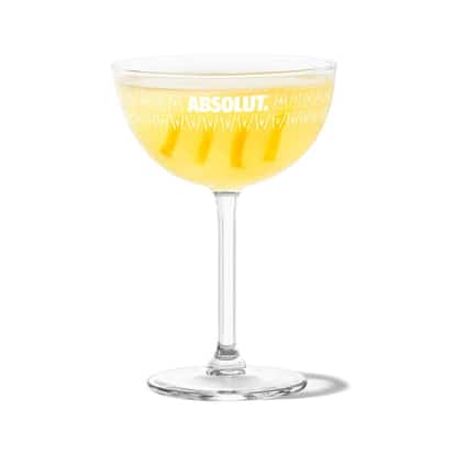 Between The Sheets served in an Absolut coupe glass with four lemon twists
