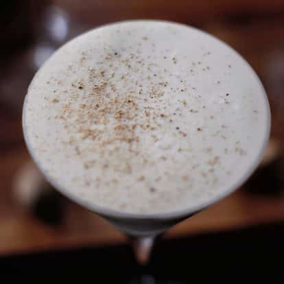 Brandy Alexander in a coupe glass topped with grated nutmeg