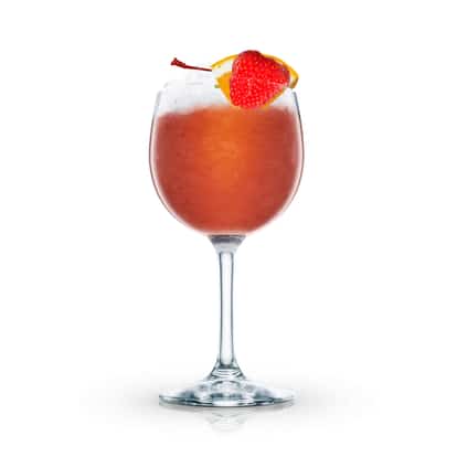 Brandy Smash served in a stemmed wine glass topped with crushed ice and a strawberry and orange wedge