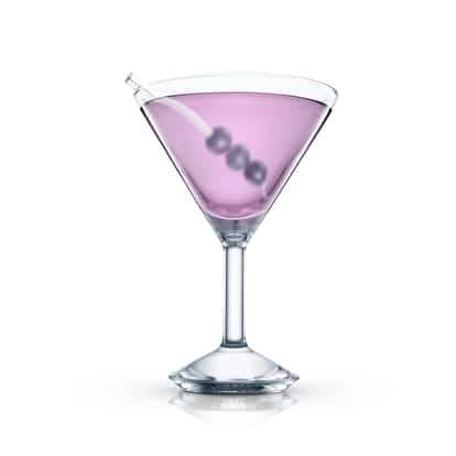Brazen Martini in a martini glass with three berries on a pick and a pipette on the rim