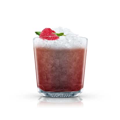 Brazilian Berry in an Absolut rocks glass with crushed ice topped with raspberries and mint on white background