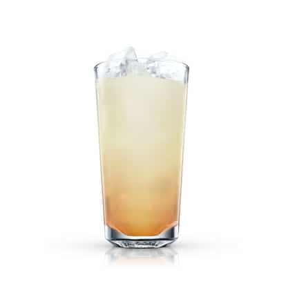 Caballo in a highball glass with ice on white background