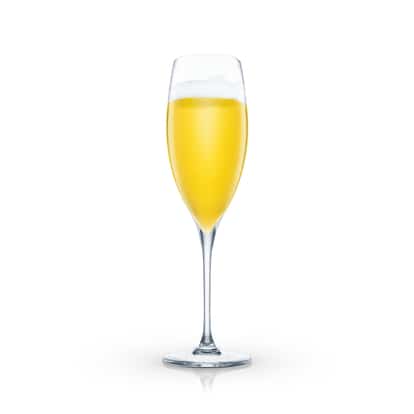 Calm Voyage cocktail in a champagne flute with foam on white background.