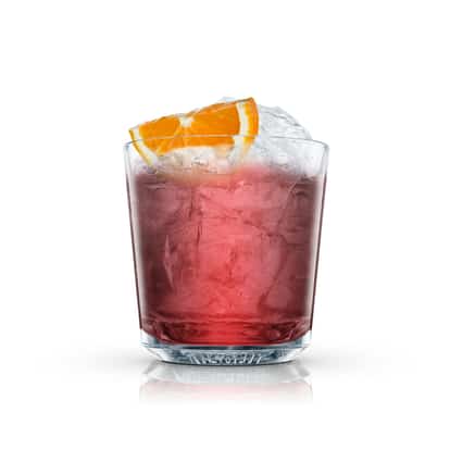 Cardinal II in an Absolut rocks glass with crushed ice and orange wedge on white background