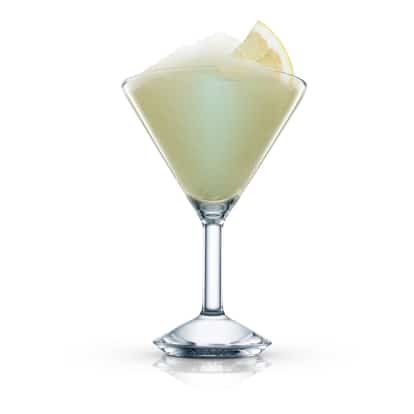 Caribbean Sensation served frozen in a martini glass with a lemon wedge on white background