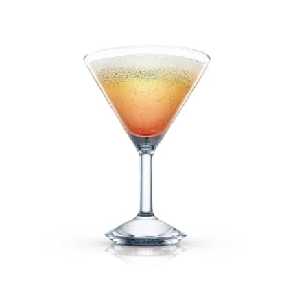 Chicago in a martini glass with layered liquids and foam on white background