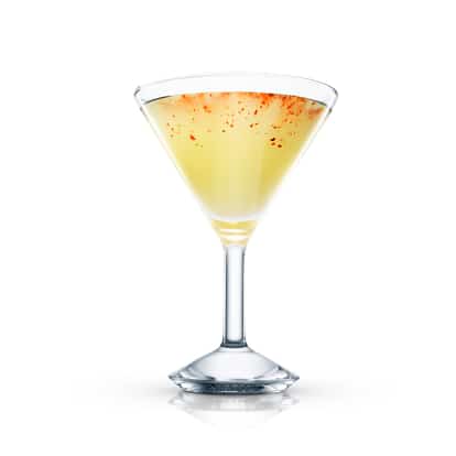 Chilean Temptation served in an Absolut martini glass garnished with chili flakes on white background