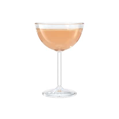 Peach-colored cocktail in a coupe glass on white background.