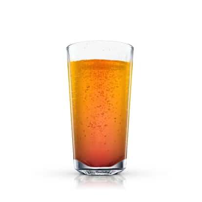 Churchill in a tall highball glass with a layered appearance and visible bubbles on white background