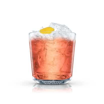 Circus Rickey served in an Absolut rocks glass with crushed ice and lemon peel on white background