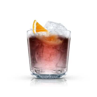 Citron Nigroni in an Absolut rocks glass with large ice cubes and an orange wedge on white background