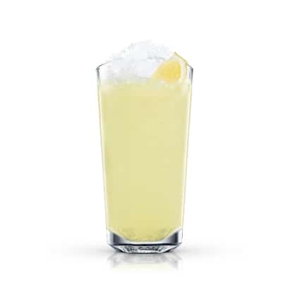 Citron Pressé in a highball glass with crushed ice and a lemon wedge on white background.