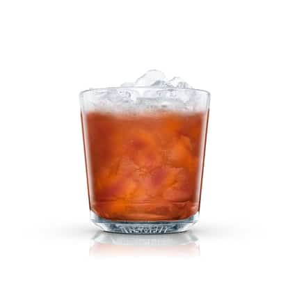 Claremont served in an Absolut rocks glass with crushed ice on white background