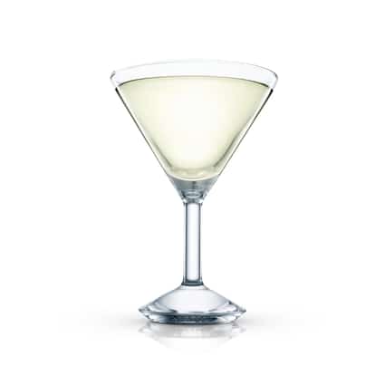 Pale lime cocktail served straight up in a stemmed martini glass on white background