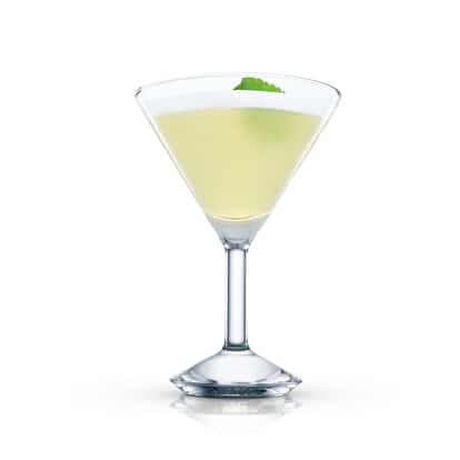 Clover Leaf in a martini glass with a single leaf garnish on white background