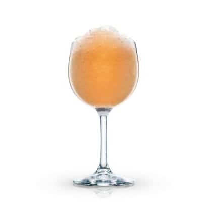 Cobra’s Fang in a stemmed wine glass topped with crushed ice on white background